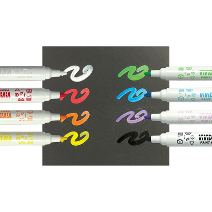 Row of markers with swatches on black paper from the OOLY Vivid Pop! Acrylic Paint Markers