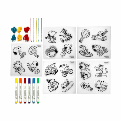 Contents of OOLY x Peanuts DIY Shrink Art Kit including cordage, beaded cords, markers and shrink sheets