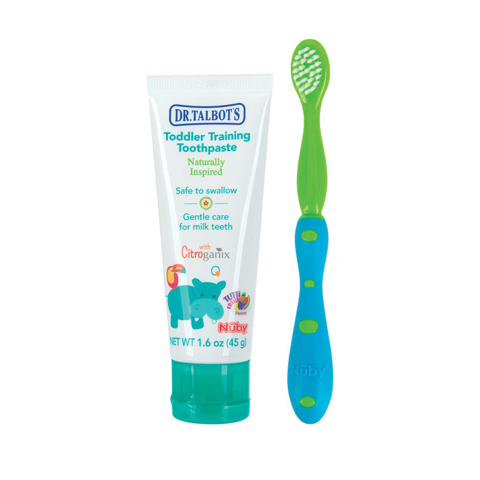 A Dr. Talbot's Toddler Toothbrush and Toothpaste Set, featuring a hippo illustration on the fluoride free, non-toxic toothpaste that’s safe to swallow and gentle for milk teeth, comes with a green and blue toothbrush beside it.
