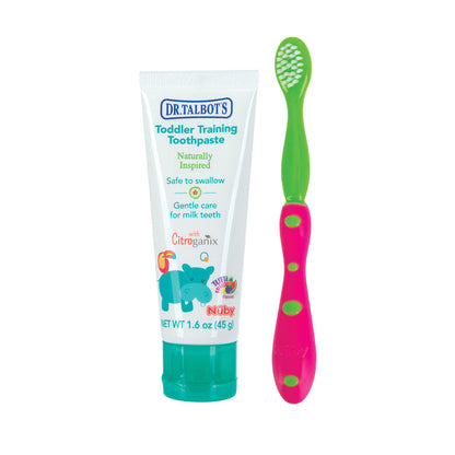 Dr. Talbot's Toddler Toothbrush and Toothpaste Set includes a green-capped, fluoride-free toothpaste with a blue hippo on the tube, safe to swallow, next to a pink and green toddler toothbrush.
