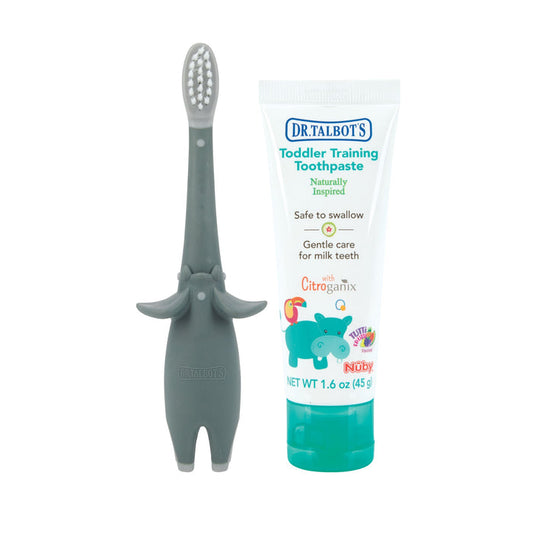 Dr. Talbot's Toddler Training Toothbrush, shaped like a gray elephant, stands beside a tube of fluoride-free toothpaste with colorful graphics and text on a white background.