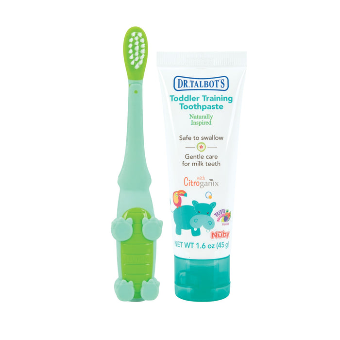 Dr. Talbot's Toddler Training Toothbrush with Toothpaste features a green crocodile-design brush and fluoride-free, safe-to-swallow toothpaste with a blue hippo, offering gentle care for milk teeth.