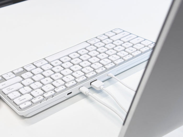Macally keyboard USB hub in use on desk with USB devices connected showing convenient port access